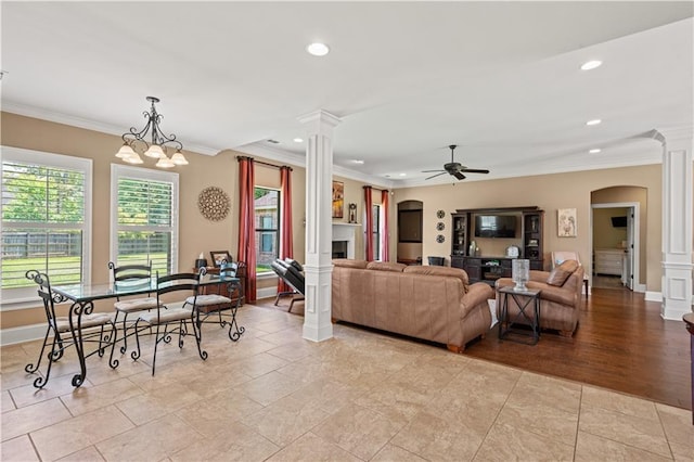 1521 Rue De Fontaine, Covington, LA 70433 - living area featuring decorative columns, arched walkways, a ceiling fan, crown molding, and recessed lighting