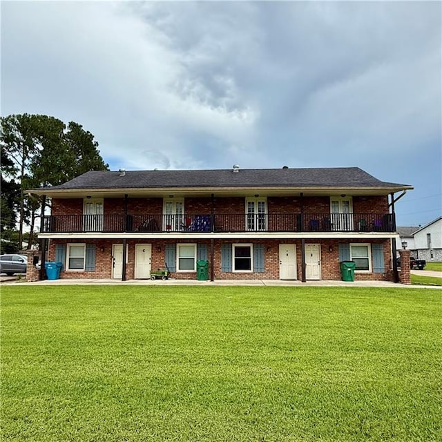 51 Brandon Hall Dr, Destrehan, LA 70047 - back of property with a lawn and brick siding