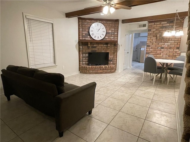 51 Brandon Hall Dr, Destrehan, LA 70047 - living room with a ceiling fan, light tile patterned floors, a fireplace, and beamed ceiling