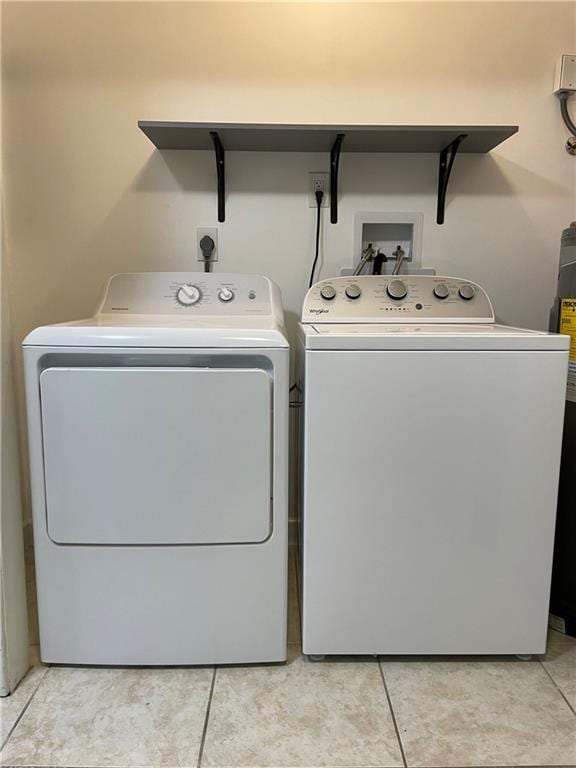 51 Brandon Hall Dr, Destrehan, LA 70047 - washroom featuring washer and dryer and light tile patterned floors