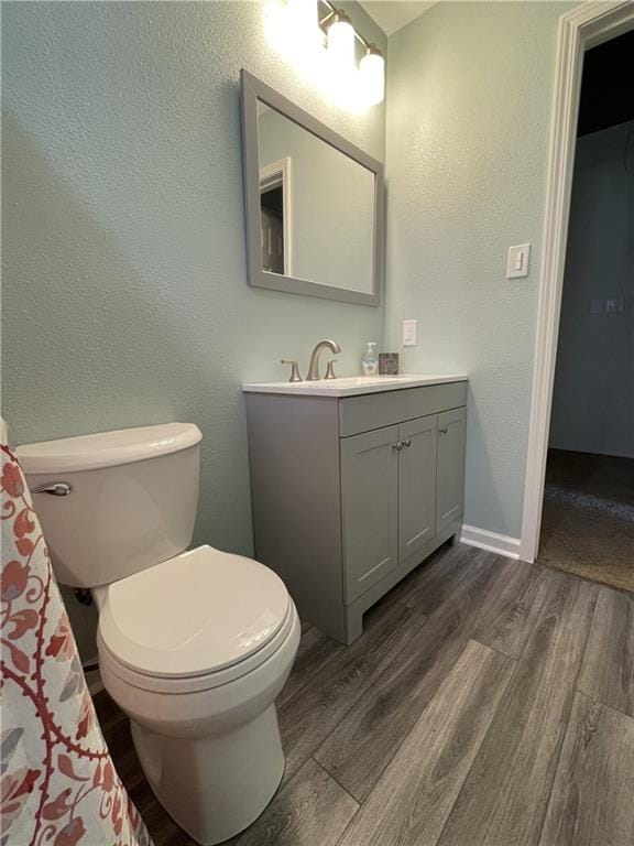 51 Brandon Hall Dr, Destrehan, LA 70047 - full bathroom with vanity, wood finished floors, and a textured wall
