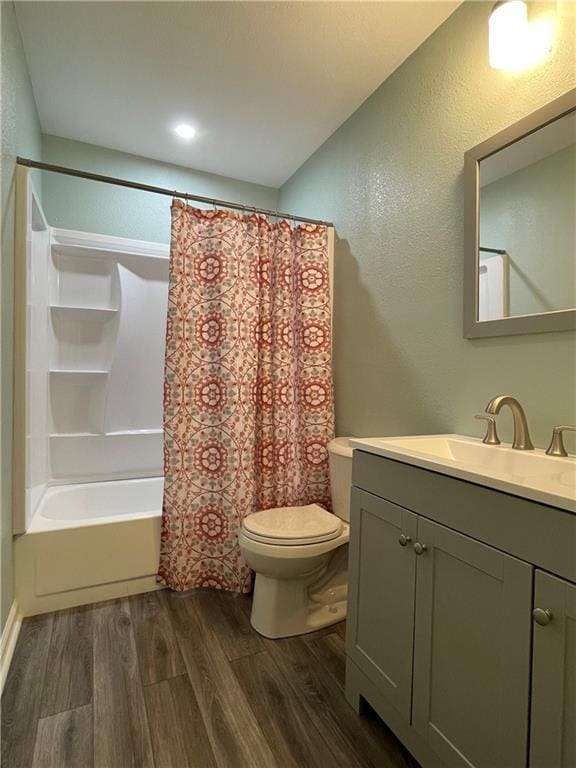 51 Brandon Hall Dr, Destrehan, LA 70047 - full bathroom featuring wood finished floors, vanity, shower / bath combo with shower curtain, and a textured wall