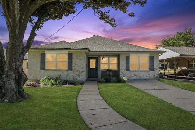 5028 Jasper St, Metairie, LA 70006 - bungalow with a front yard, roof with shingles, and brick siding
