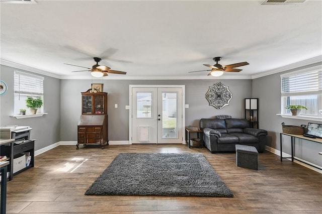 5028 Jasper St, Metairie, LA 70006 - living area featuring ceiling fan, french doors, plenty of natural light, ornamental molding, and wood finished floors
