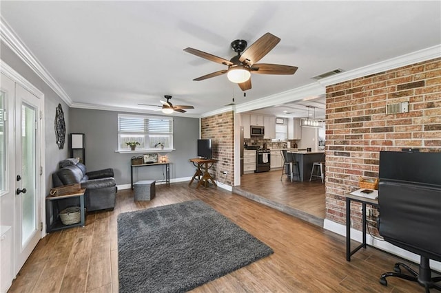 5028 Jasper St, Metairie, LA 70006 - living room featuring crown molding, ceiling fan, and wood finished floors