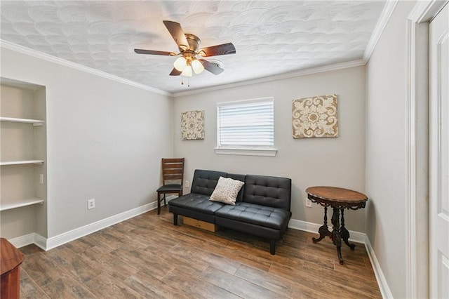 5028 Jasper St, Metairie, LA 70006 - sitting room with a ceiling fan, built in features, wood finished floors, and crown molding
