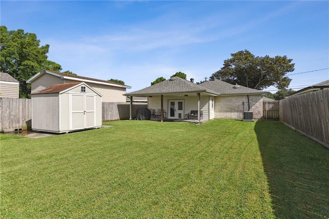 5028 Jasper St, Metairie, LA 70006 - rear view of property featuring french doors, a fenced backyard, and a shed