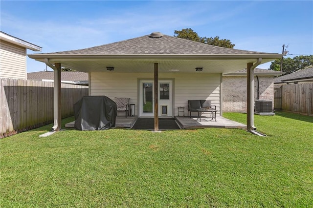 5028 Jasper St, Metairie, LA 70006 - rear view of property with a fenced backyard, a shingled roof, and a patio area