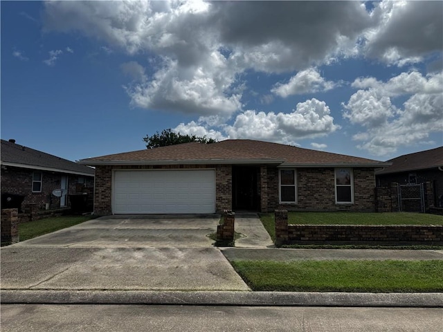 5301 E Idlewood Ct, New Orleans, LA 70128 - ranch-style house with concrete driveway, a garage, and brick siding