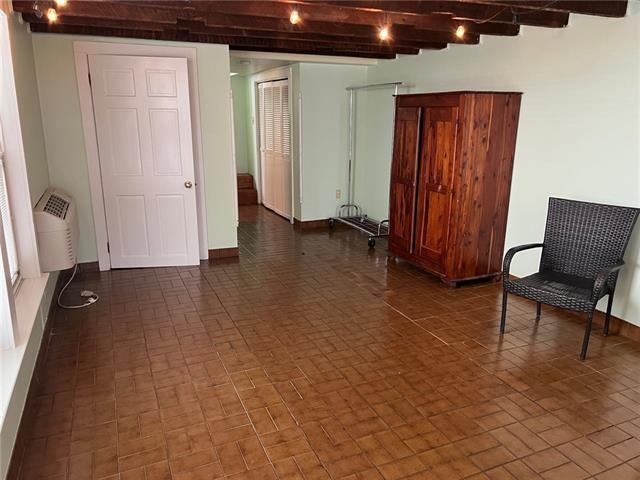 400 Millaudon St, New Orleans, LA 70118 - basement with brick patterned floors and baseboards