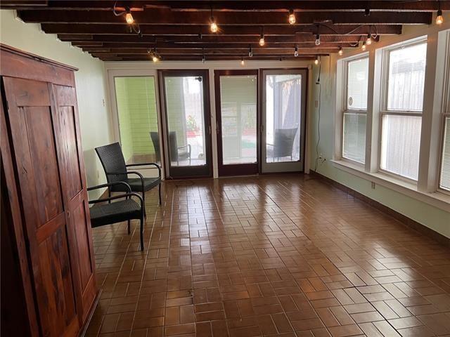 400 Millaudon St, New Orleans, LA 70118 - sunroom / solarium with beamed ceiling and track lighting