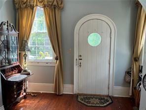 400 Millaudon St, New Orleans, LA 70118 - entryway with arched walkways and dark wood-style floors