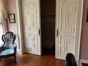 400 Millaudon St, New Orleans, LA 70118 - living area featuring baseboards and dark wood-type flooring