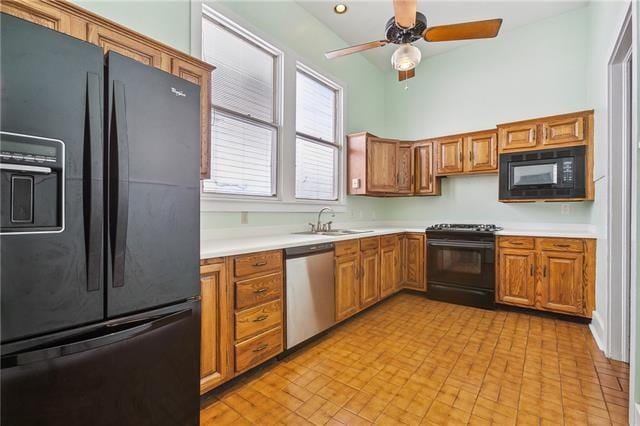 400 Millaudon St, New Orleans, LA 70118 - kitchen with black appliances, light countertops, a ceiling fan, and brown cabinets