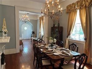 400 Millaudon St, New Orleans, LA 70118 - dining room featuring a chandelier, wood finished floors, and arched walkways