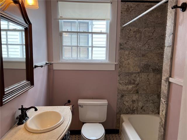 400 Millaudon St, New Orleans, LA 70118 - bathroom featuring plenty of natural light, vanity, and bathing tub / shower combination