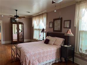 400 Millaudon St, New Orleans, LA 70118 - bedroom with wood finished floors and baseboards