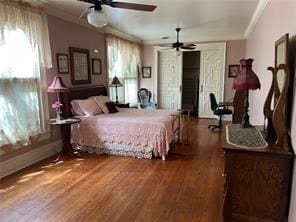 400 Millaudon St, New Orleans, LA 70118 - bedroom with crown molding, multiple windows, and wood finished floors