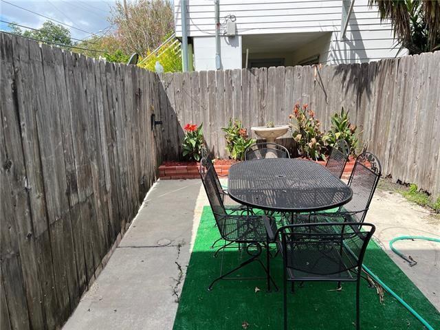 400 Millaudon St, New Orleans, LA 70118 - fenced backyard featuring a patio area and outdoor dining area