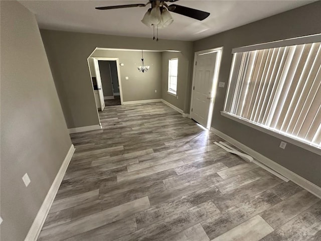3046 Slidell Ave, Slidell, LA 70458 - unfurnished room featuring a ceiling fan, wood finished floors, and a chandelier