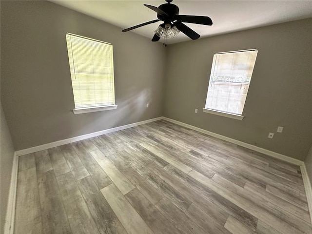 3046 Slidell Ave, Slidell, LA 70458 - unfurnished room with healthy amount of natural light, wood finished floors, and a ceiling fan