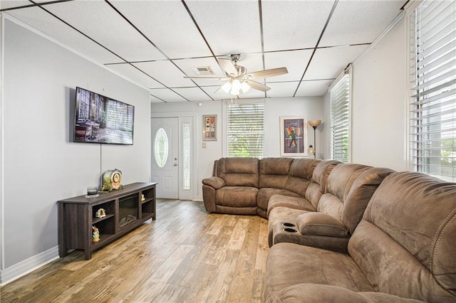 5225 Conti St, New Orleans, LA 70124 - living room with light wood-style flooring, ceiling fan, and a paneled ceiling