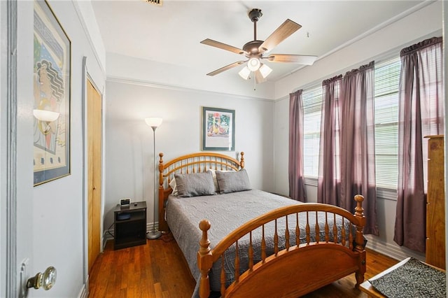 5225 Conti St, New Orleans, LA 70124 - bedroom with wood finished floors and ceiling fan