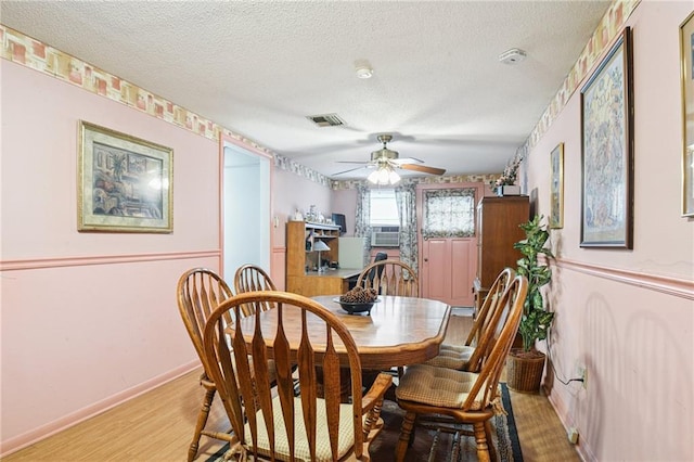5225 Conti St, New Orleans, LA 70124 - dining area with a textured ceiling, ceiling fan, and light wood-style floors