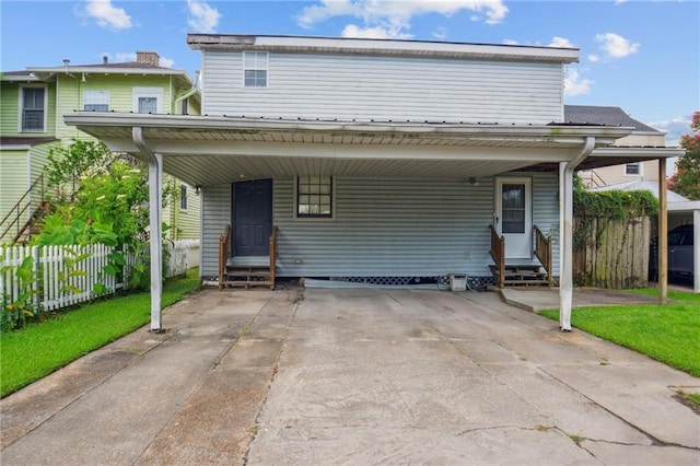 5225 Conti St, New Orleans, LA 70124 - traditional-style home featuring entry steps, a carport, and concrete driveway