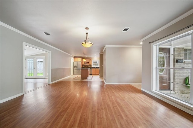 2636 Somerset Dr, New Orleans, LA 70131 - unfurnished living room featuring light wood-type flooring and ornamental molding