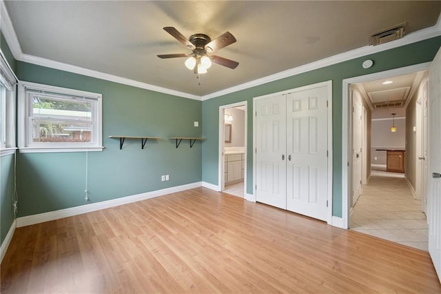 2636 Somerset Dr, New Orleans, LA 70131 - unfurnished bedroom featuring attic access, light wood-style flooring, a closet, ornamental molding, and connected bathroom