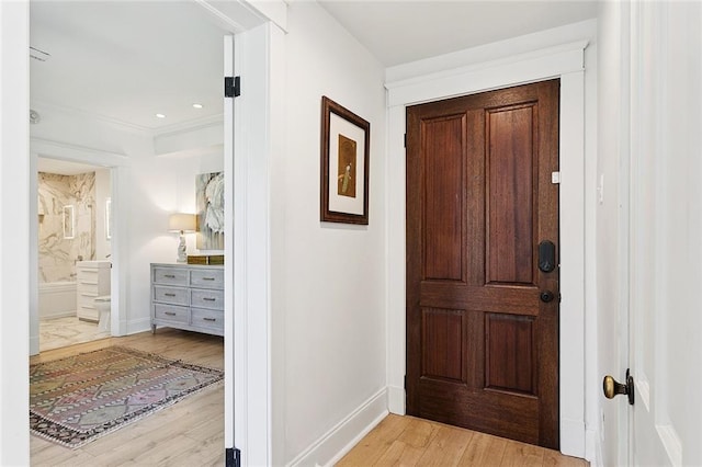 1783 Coliseum St Unit H, New Orleans, LA 70130 - foyer entrance with light wood finished floors and ornamental molding