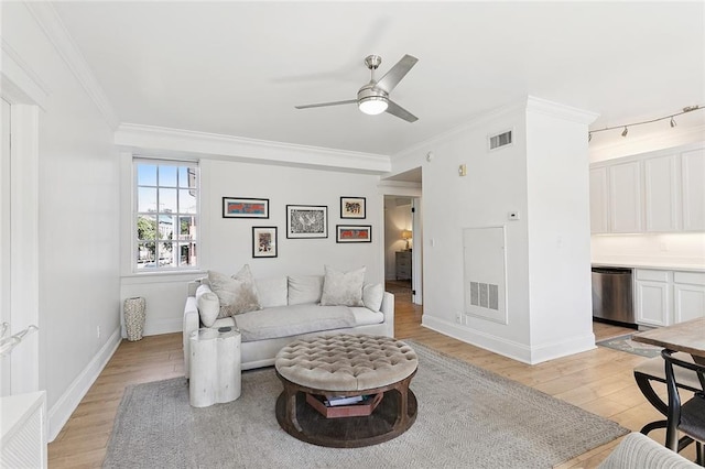 1783 Coliseum St Unit H, New Orleans, LA 70130 - living area with light wood-style floors, a ceiling fan, ornamental molding, and track lighting