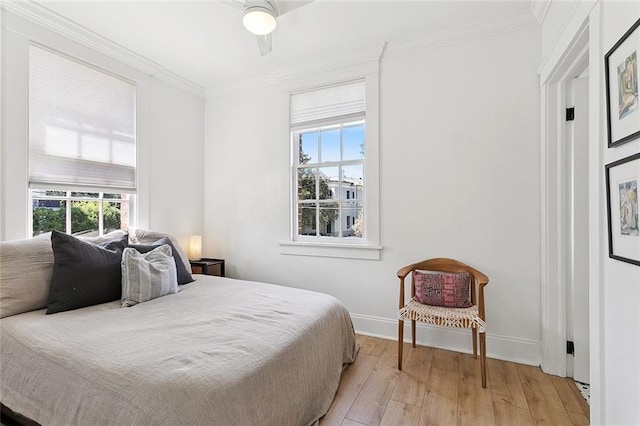 1783 Coliseum St Unit H, New Orleans, LA 70130 - bedroom featuring light wood-type flooring, crown molding, and ceiling fan