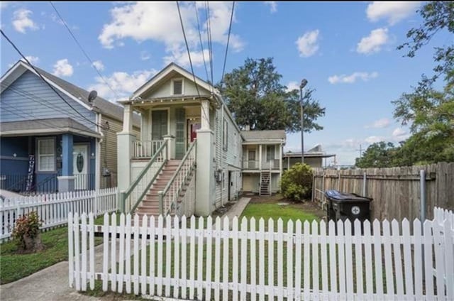 3026 Short St, New Orleans, LA 70125 - view of front of property featuring a fenced front yard, stairway, and covered porch
