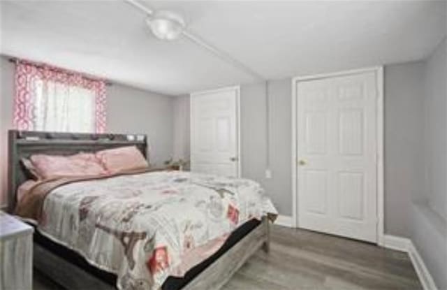 3026 Short St, New Orleans, LA 70125 - bedroom with wood finished floors and baseboards