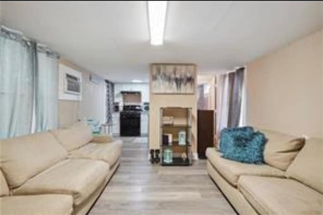 3026 Short St, New Orleans, LA 70125 - living area with light wood-style flooring