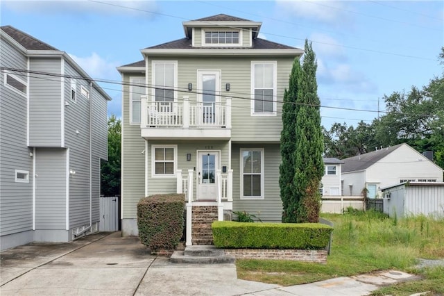 125 Broadway St, New Orleans, LA 70118 - view of front of property with a balcony and concrete driveway