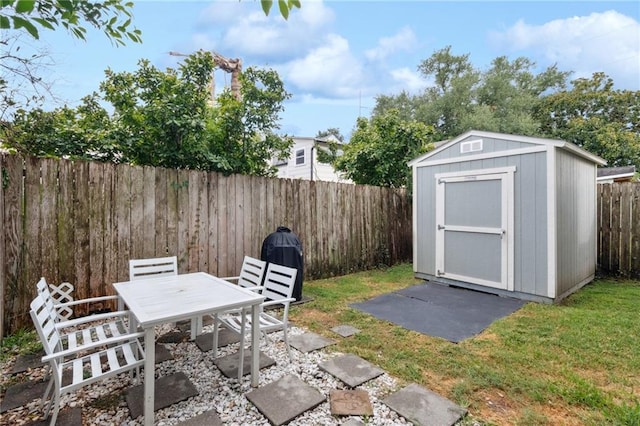 125 Broadway St, New Orleans, LA 70118 - fenced backyard with a storage shed, outdoor dining area, and a patio area