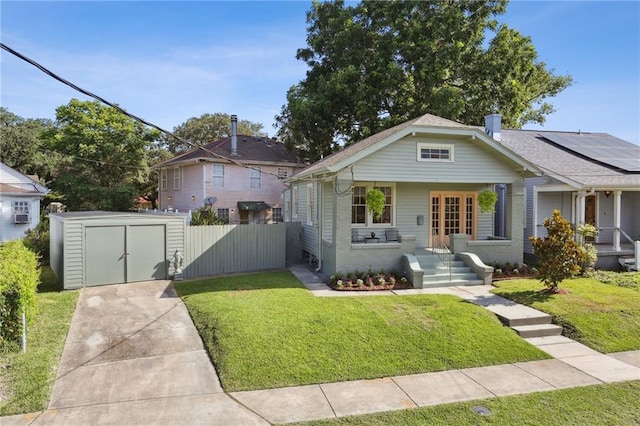 2303 Wisteria St, New Orleans, LA 70122 - bungalow-style home featuring a shed, a porch, and brick siding