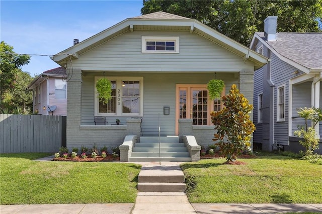 2303 Wisteria St, New Orleans, LA 70122 - bungalow-style house with brick siding and a porch