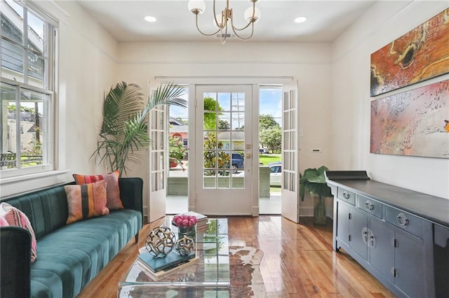 2303 Wisteria St, New Orleans, LA 70122 - entryway featuring plenty of natural light, light wood-type flooring, a chandelier, french doors, and recessed lighting