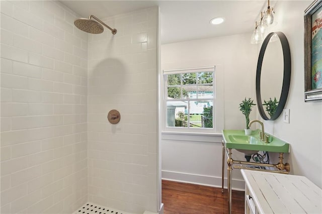 2303 Wisteria St, New Orleans, LA 70122 - bathroom with a tile shower and wood finished floors