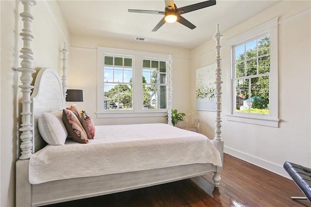 2303 Wisteria St, New Orleans, LA 70122 - bedroom featuring dark wood finished floors and a ceiling fan