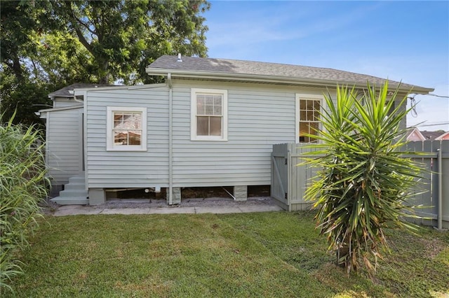 2303 Wisteria St, New Orleans, LA 70122 - rear view of house with roof with shingles
