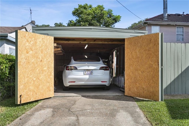 2303 Wisteria St, New Orleans, LA 70122 - view of parking / parking lot with driveway and a carport