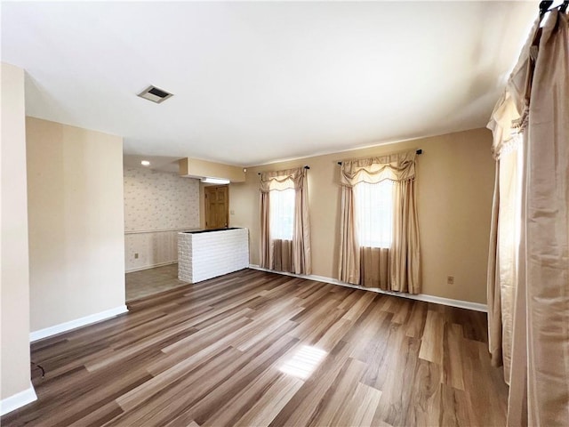 6012 Bridget St, Metairie, LA 70003 - spare room featuring wood finished floors and baseboards