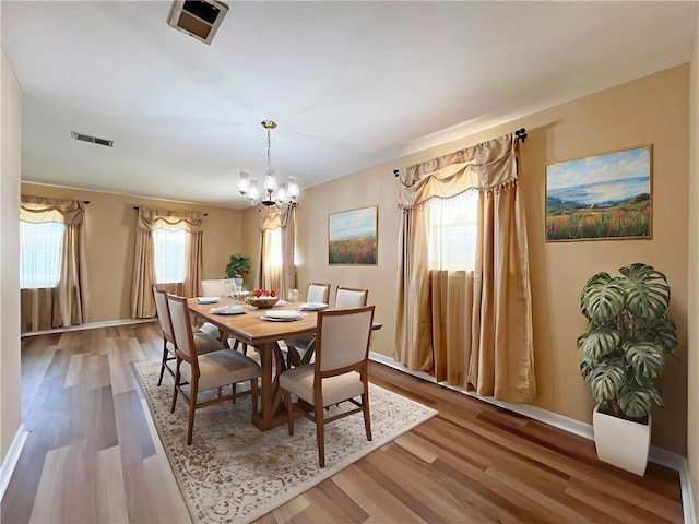 6012 Bridget St, Metairie, LA 70003 - dining room featuring a chandelier and wood finished floors
