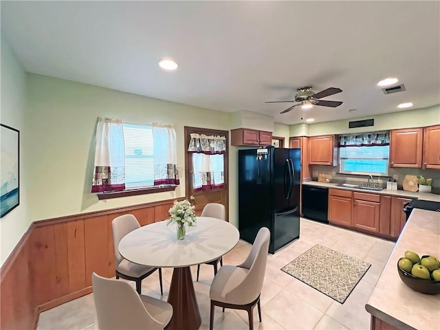 6012 Bridget St, Metairie, LA 70003 - kitchen with black appliances, light countertops, light tile patterned flooring, a ceiling fan, and tasteful backsplash