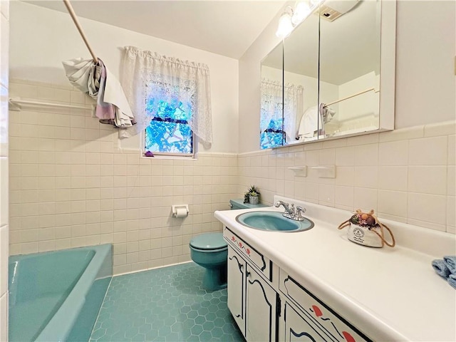 6012 Bridget St, Metairie, LA 70003 - full bathroom featuring vanity, tile walls, a wainscoted wall, and tile patterned flooring